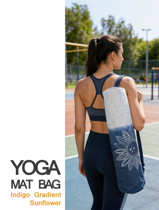 Woman holding a yoga mat with an indigo gradient and sunflower design, standing on a sports field.