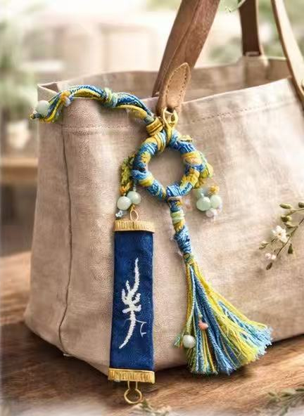 BA-15: Handmade Nüshu Batik Bag Ornament – Sunshine Character
