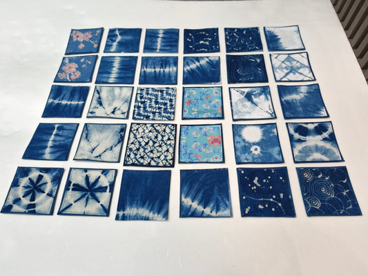Grid of blue fabric samples with various patterns on a white background