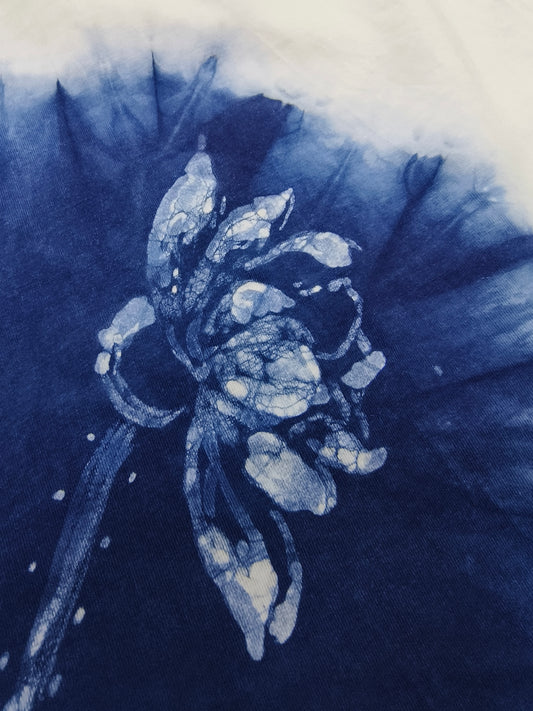 Blue and white floral design on a textured fabric background