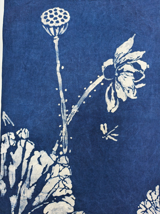 White floral design on a blue fabric background