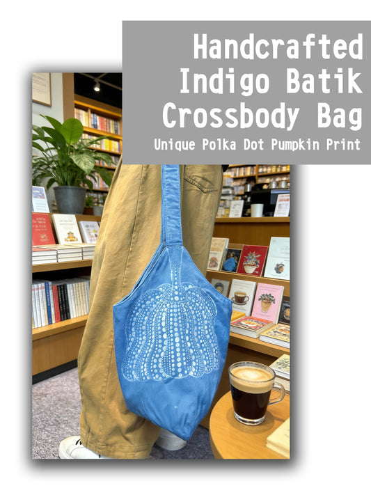 Handcrafted Indigo Batik Crossbody Bag with Polka Dot Pumpkin Print in a bookstore setting
