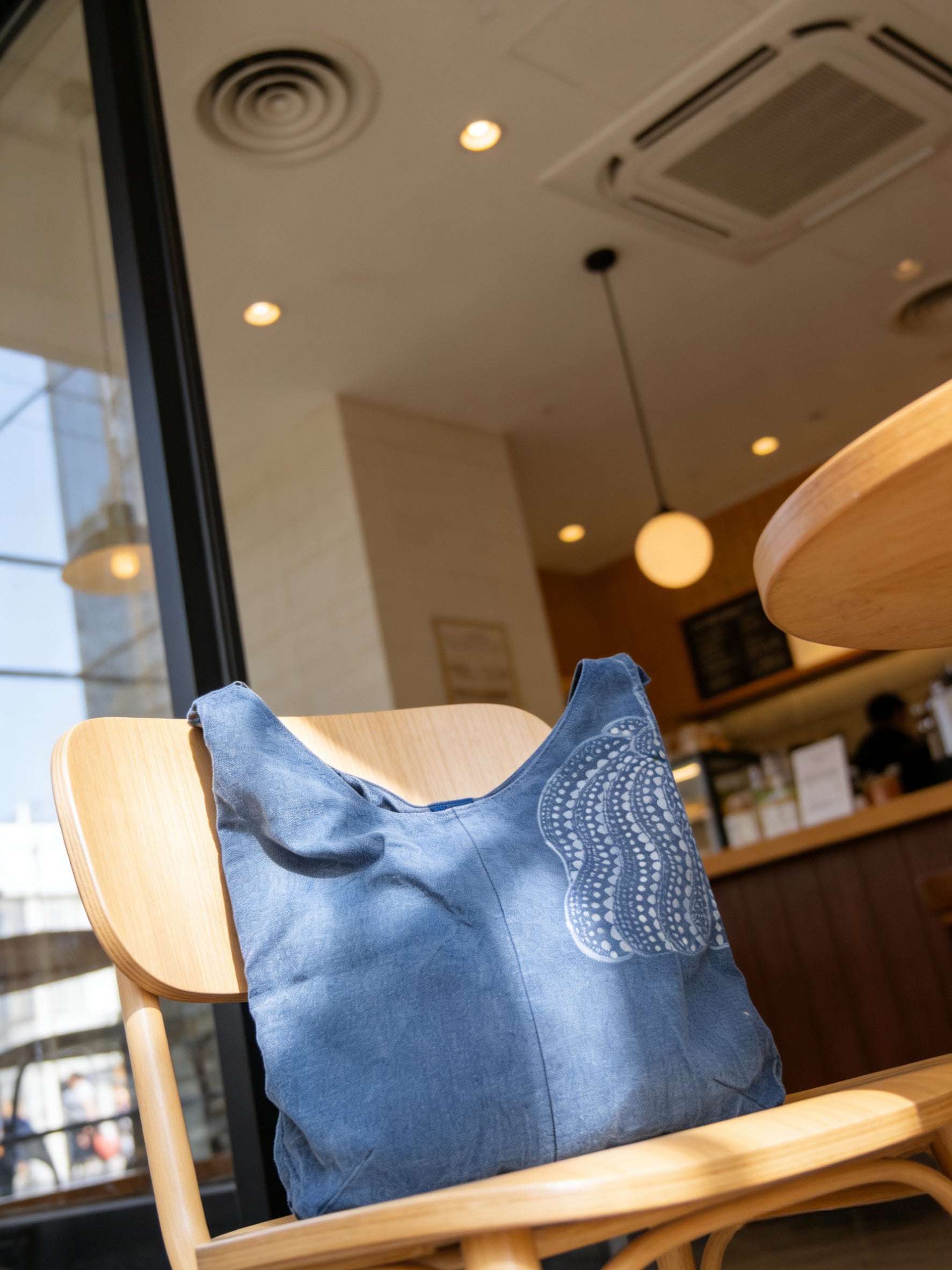 Blue cushion on a chair in a cafe setting