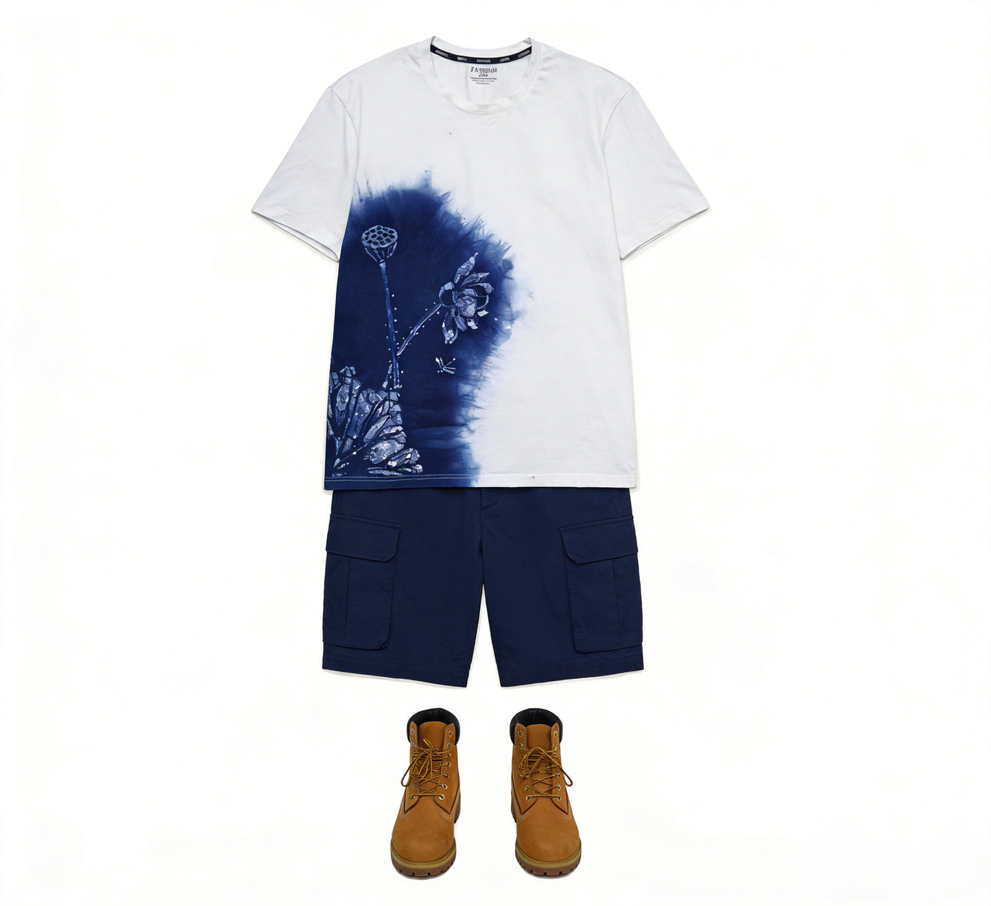 White t-shirt with blue floral design, navy cargo shorts, and brown boots on a white background