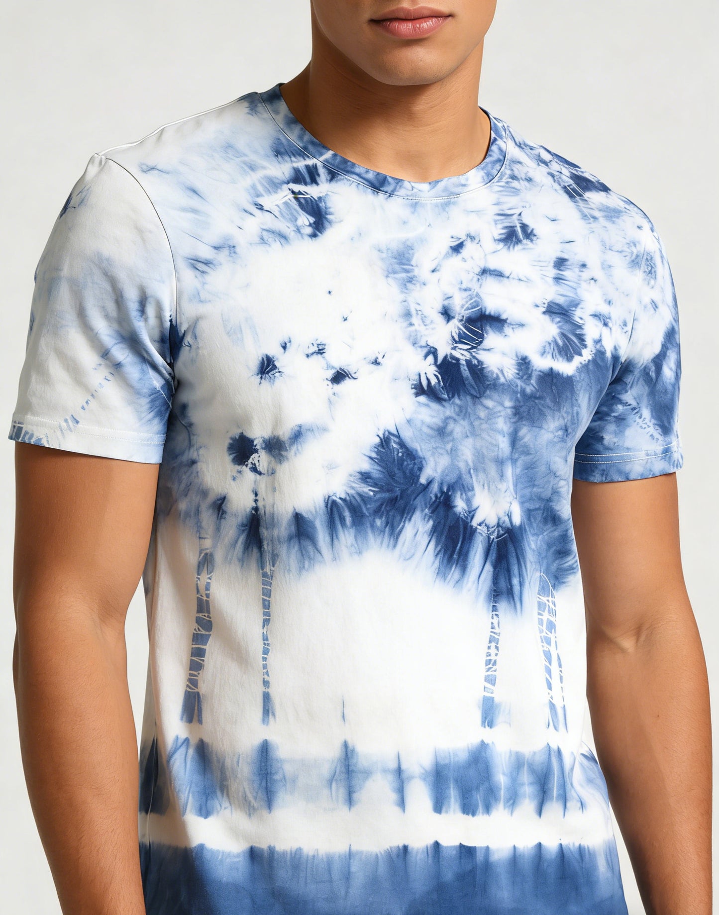 Person wearing a blue and white tie-dye t-shirt against a neutral background