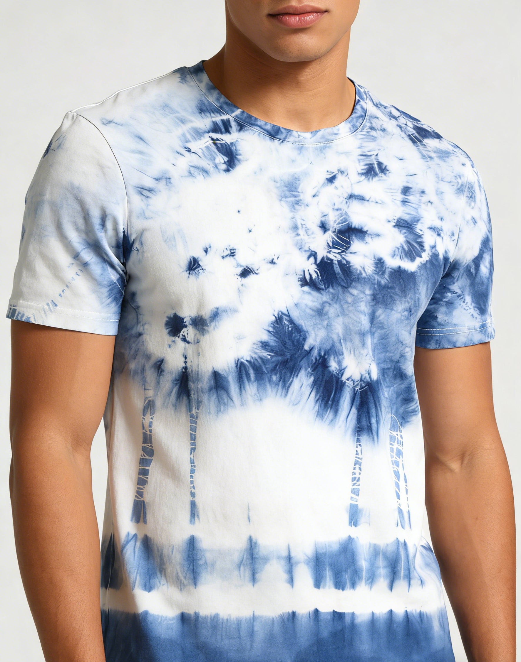 Person wearing a blue and white tie-dye t-shirt against a neutral background