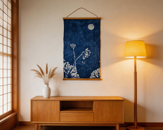 Room interior with wooden cabinet, lamp, and wall art