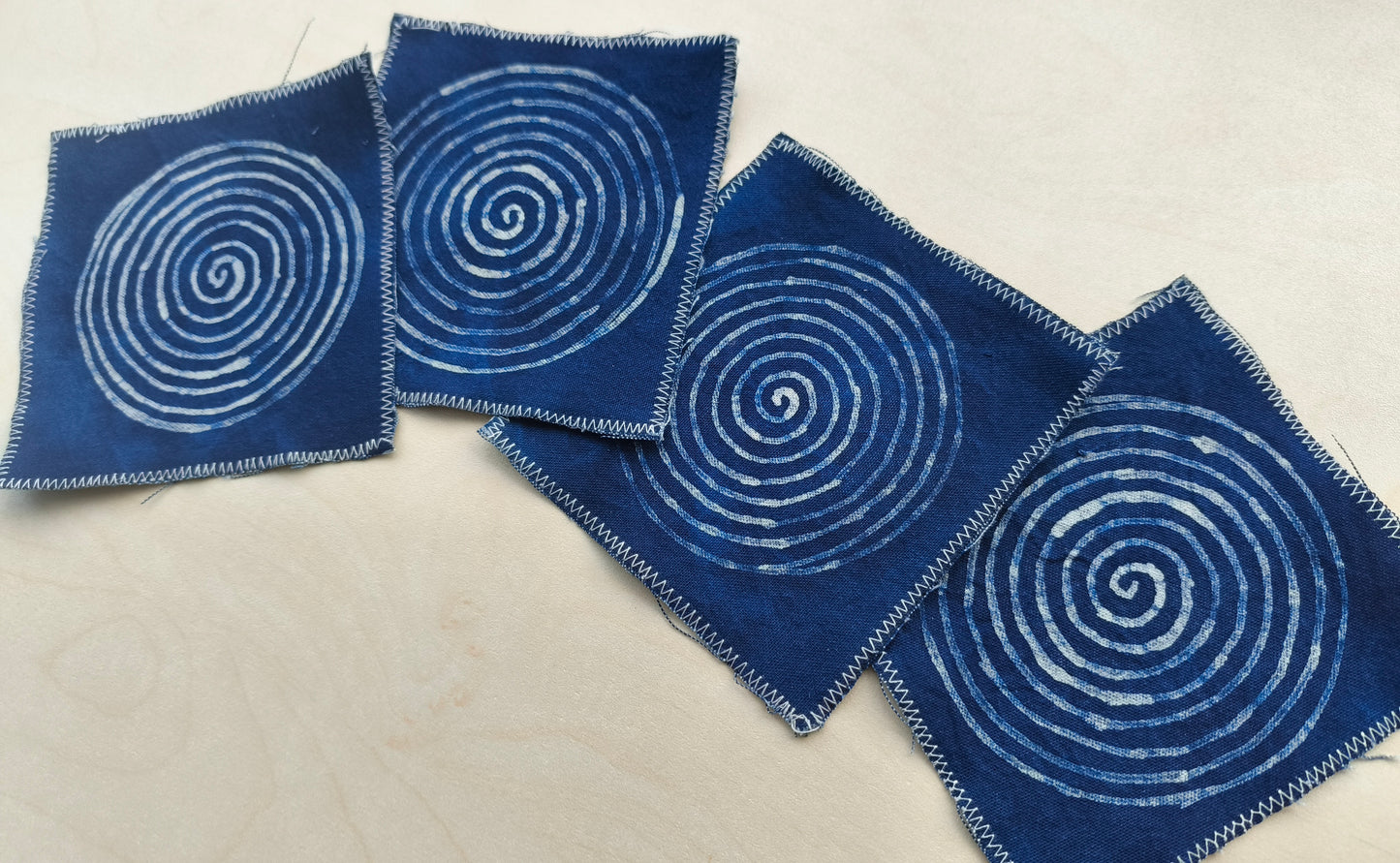 BA-12: Indigo Spiral Batik Coaster Set – Handmade Textile Art for the Table