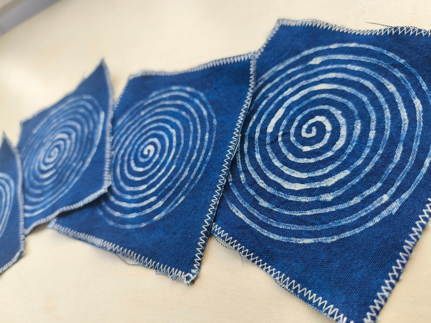 BA-12: Indigo Spiral Batik Coaster Set – Handmade Textile Art for the Table