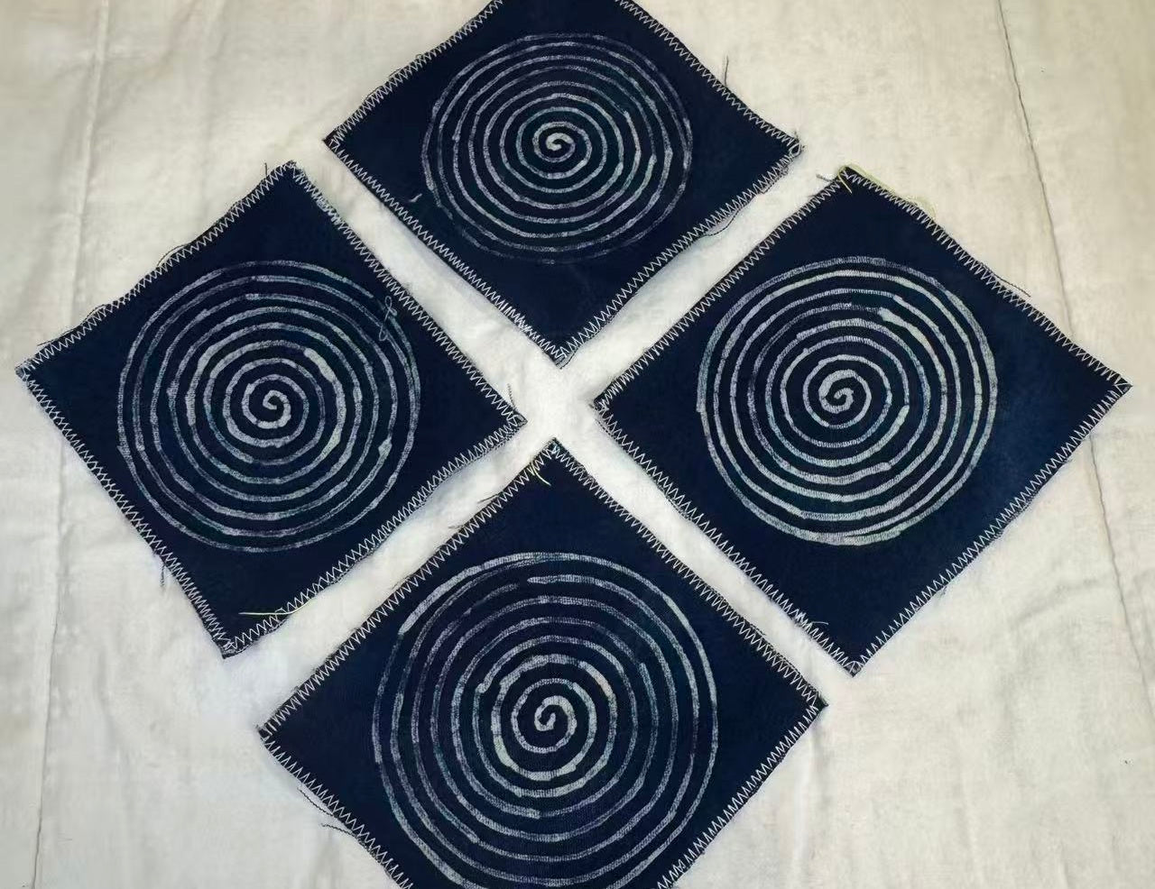BA-12: Indigo Spiral Batik Coaster Set – Handmade Textile Art for the Table