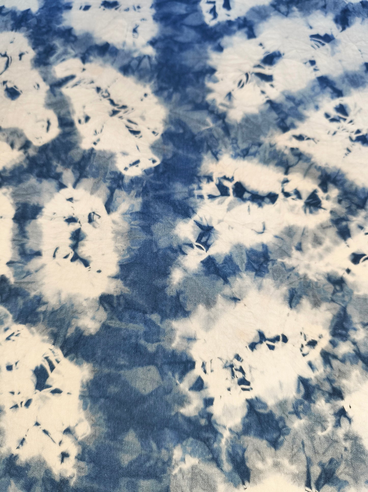 Abstract pattern of blue and white colors on a textured background