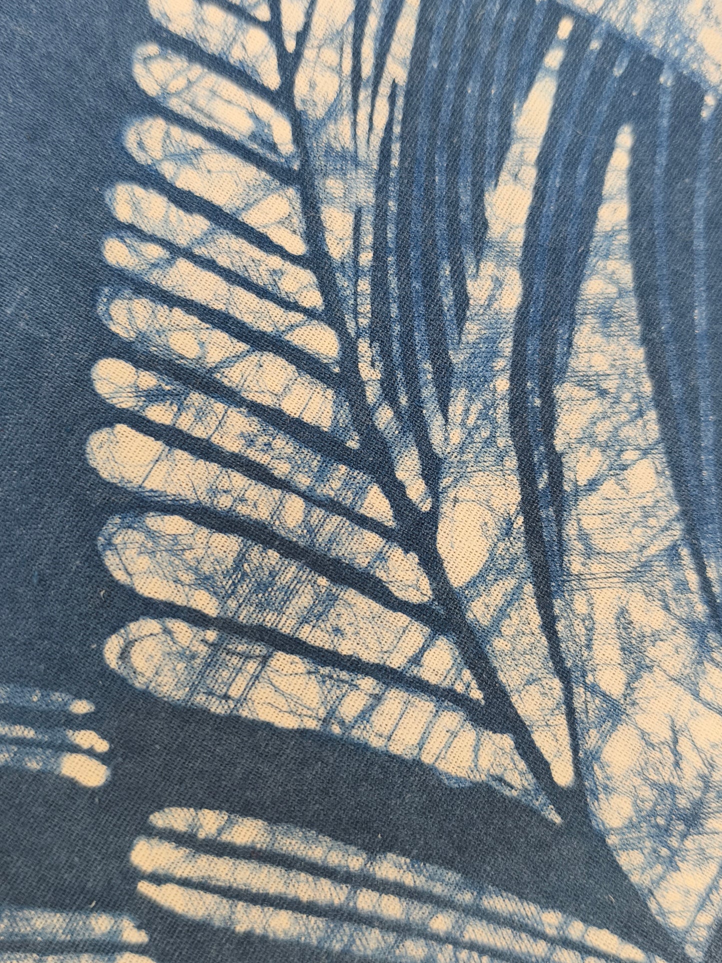 Close-up of a leaf pattern with a blue and beige color scheme