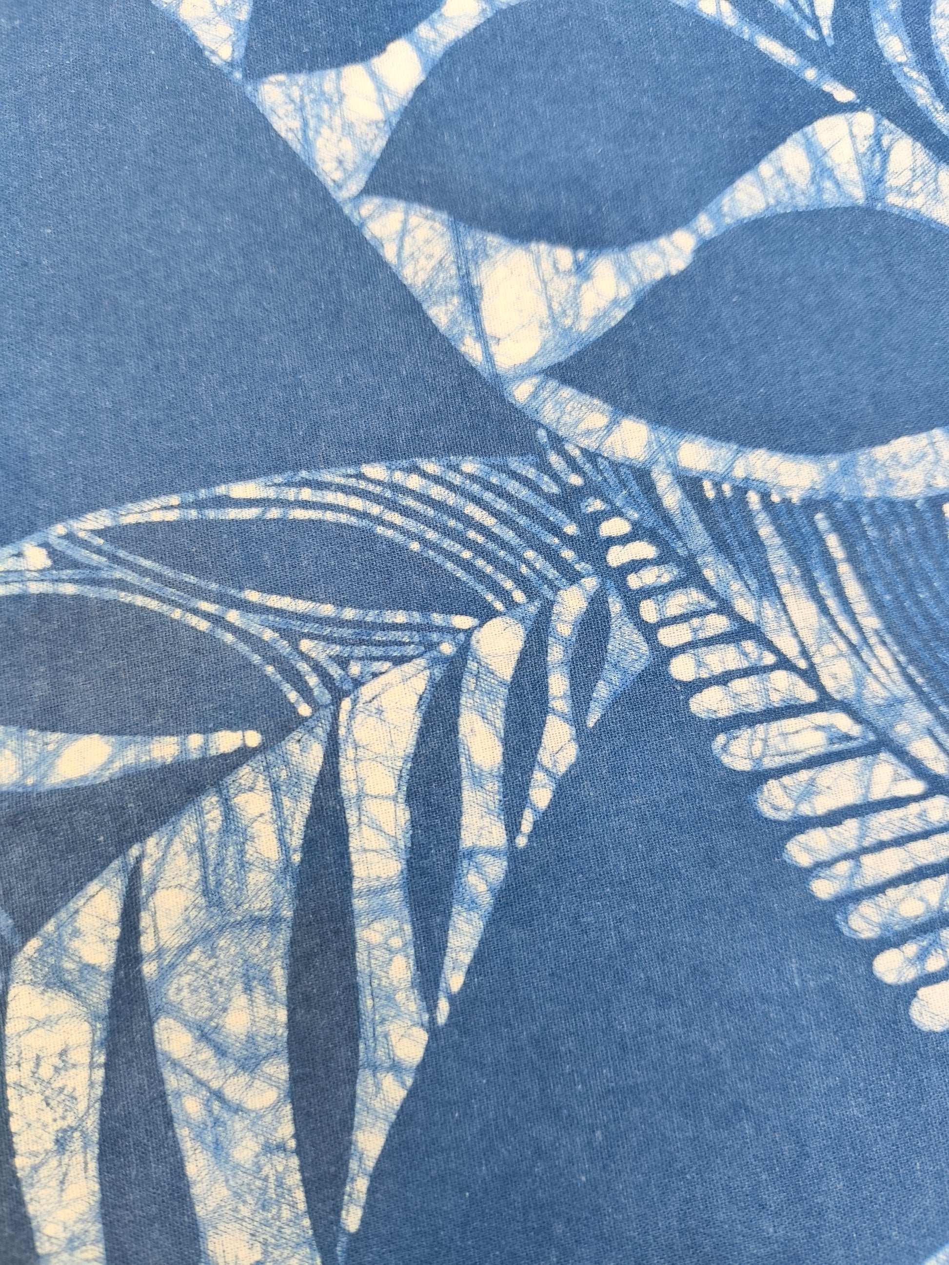 Abstract pattern with blue and beige shapes on a blue background