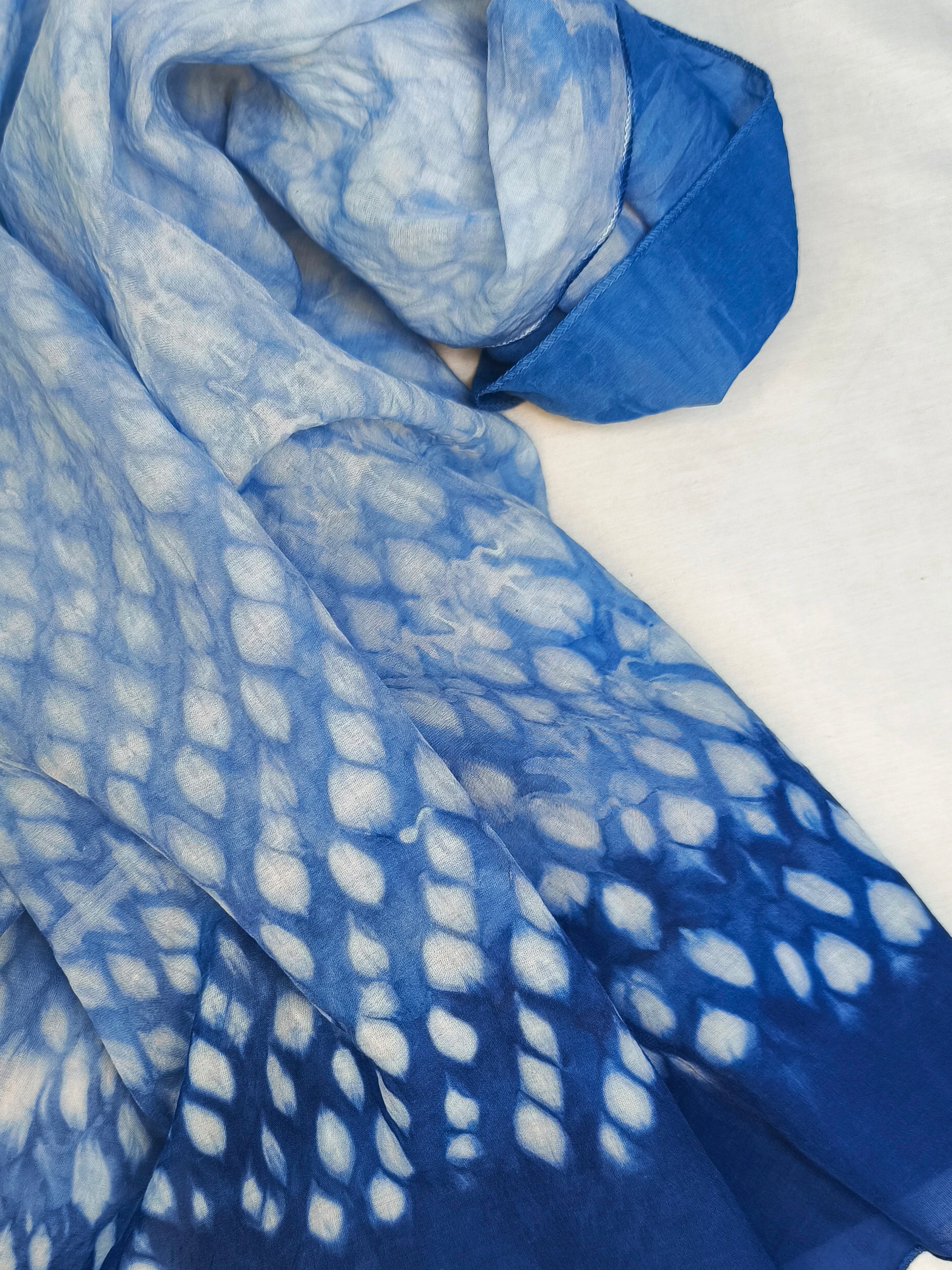 Blue and white patterned fabric on a white background