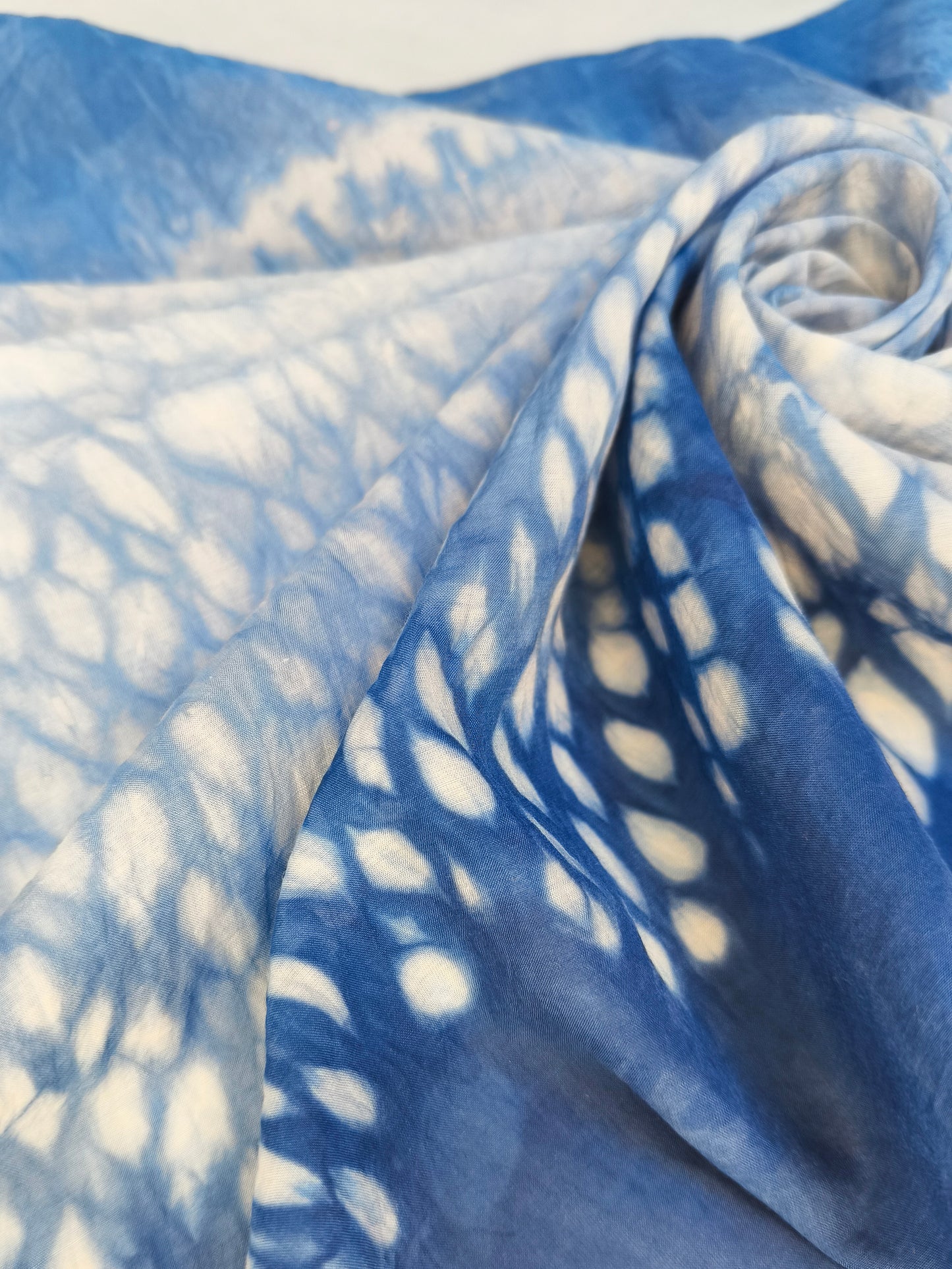 Blue fabric with white abstract pattern