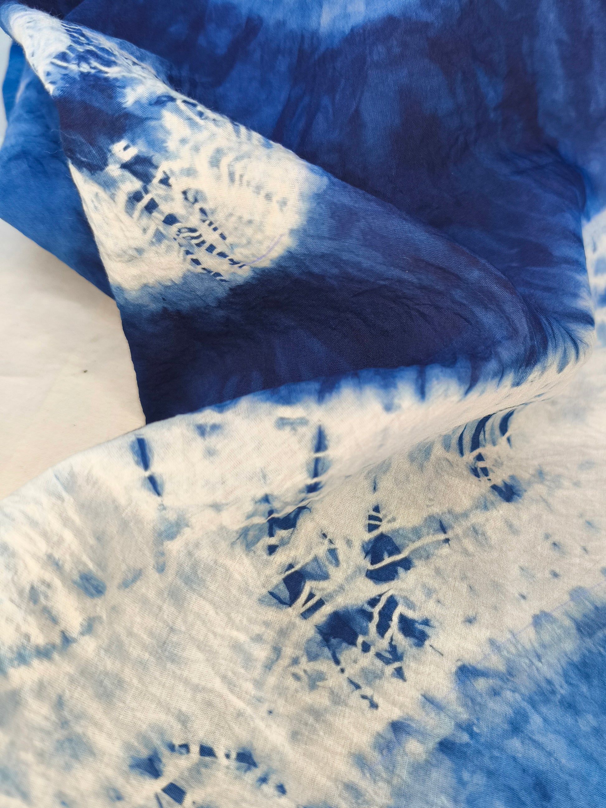 Close-up of blue and white tie-dye fabric