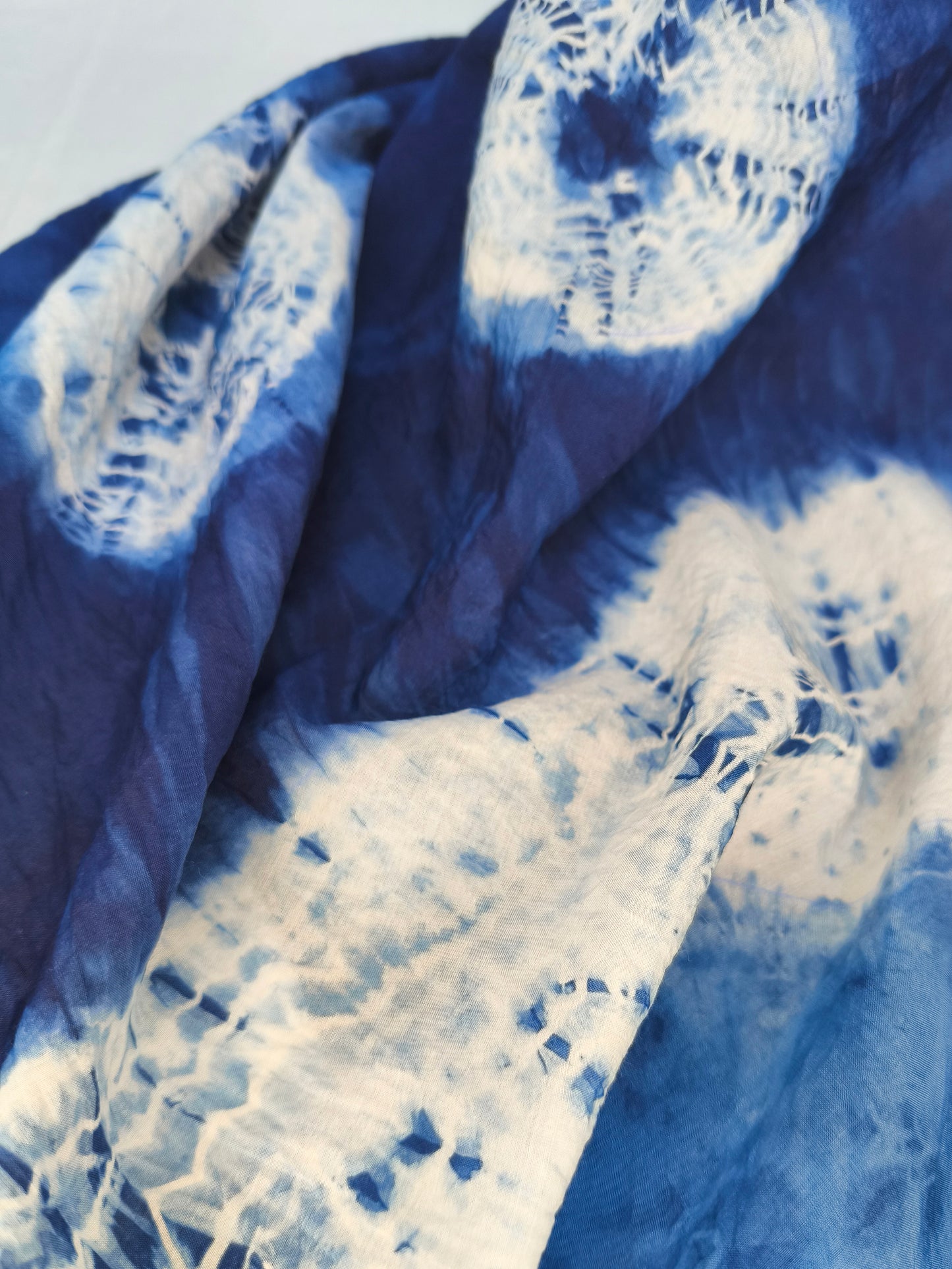 Blue and white tie-dye fabric pattern