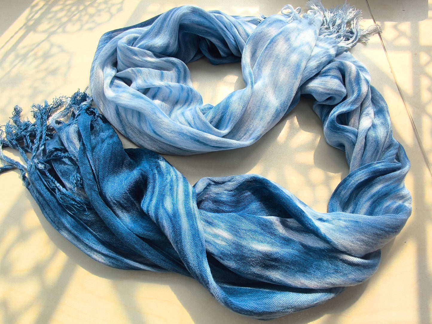 Blue and white scarf on a light surface