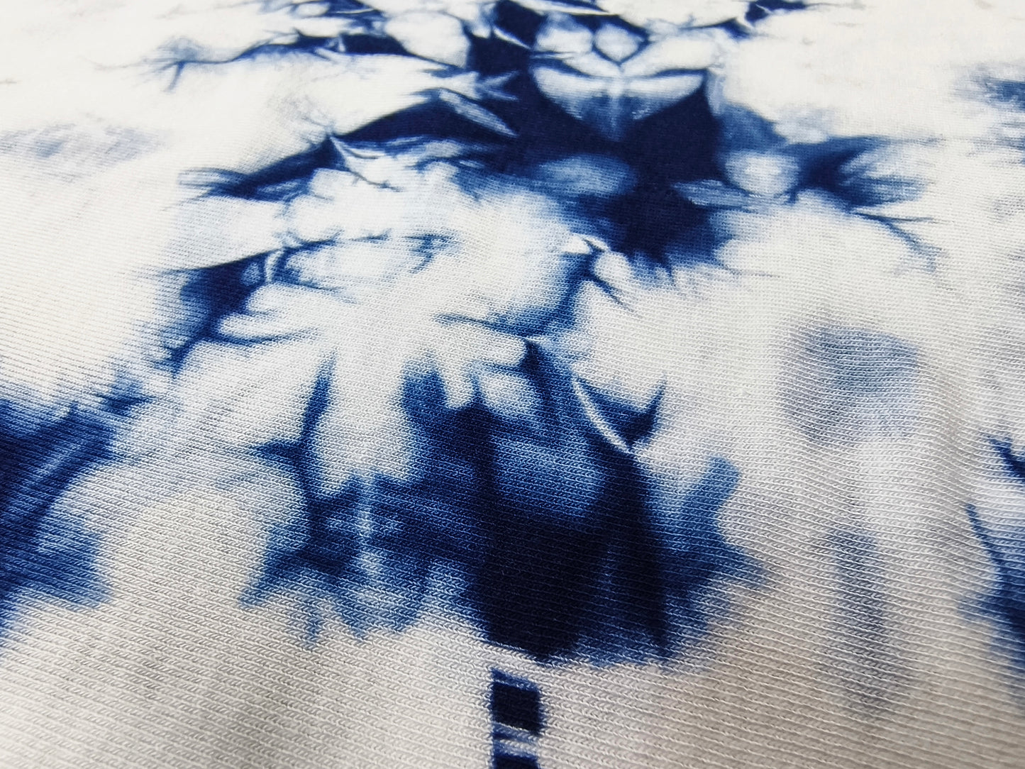 Close-up of blue and white tie-dye fabric pattern