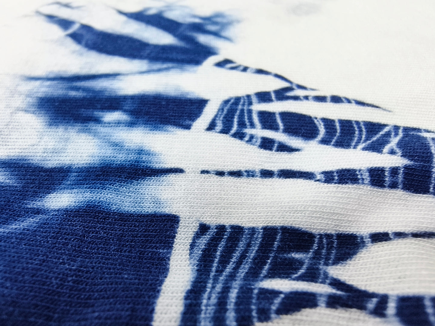 Close-up of blue and white tie-dye fabric
