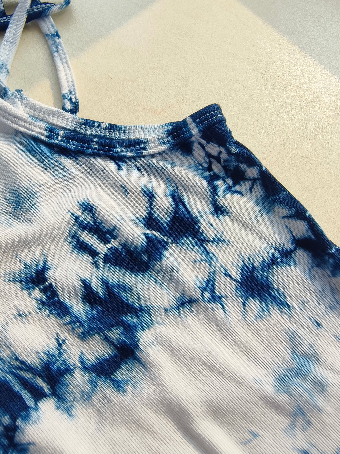 Blue and white tie-dye pattern on fabric
