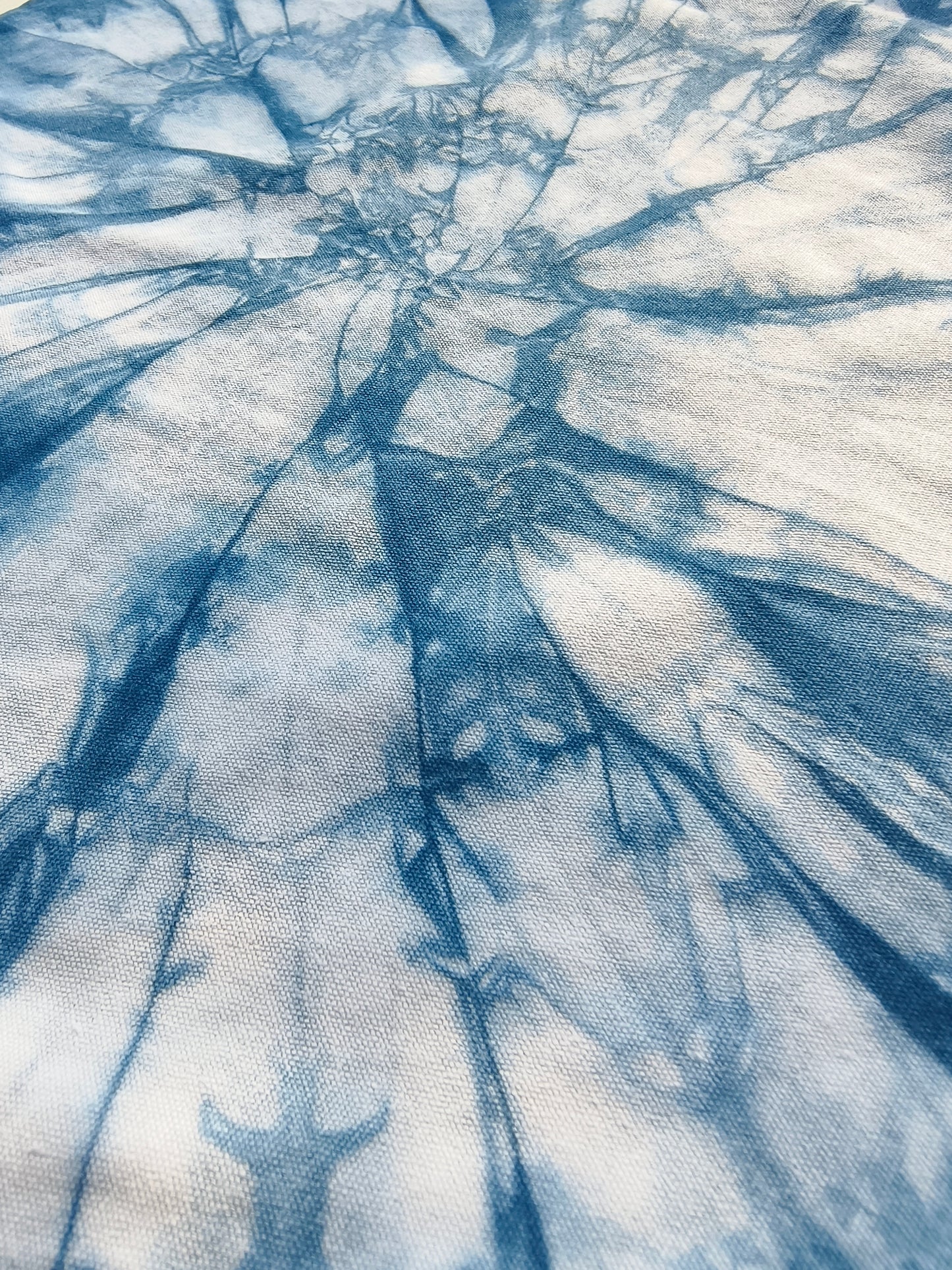 Blue and white tie-dye pattern on fabric