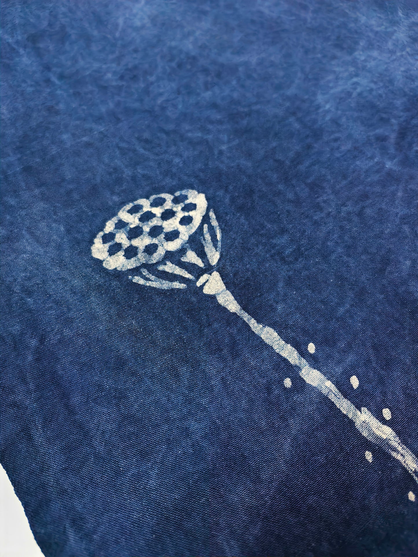 White lacrosse stick design on a blue textured fabric background