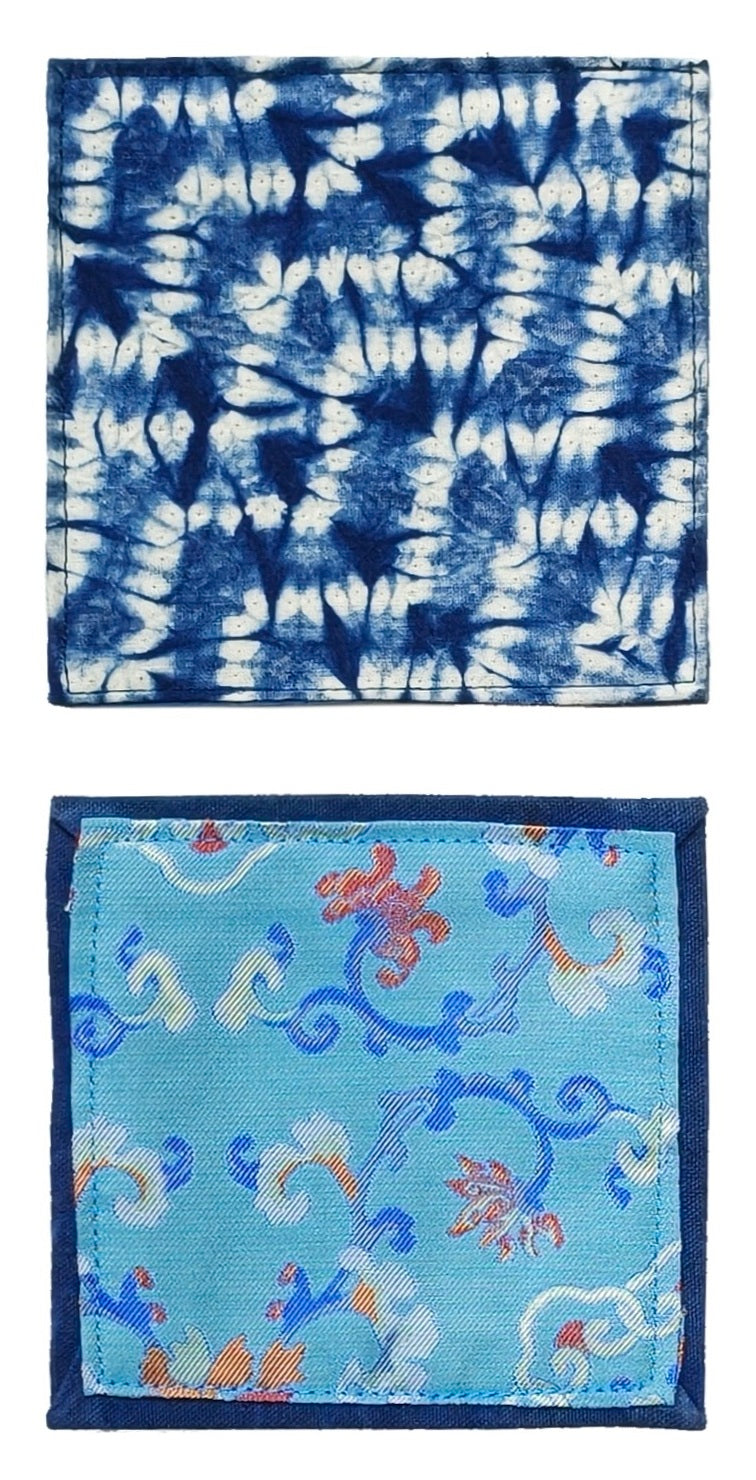 Two fabric samples with tie-dye and floral patterns on a white background