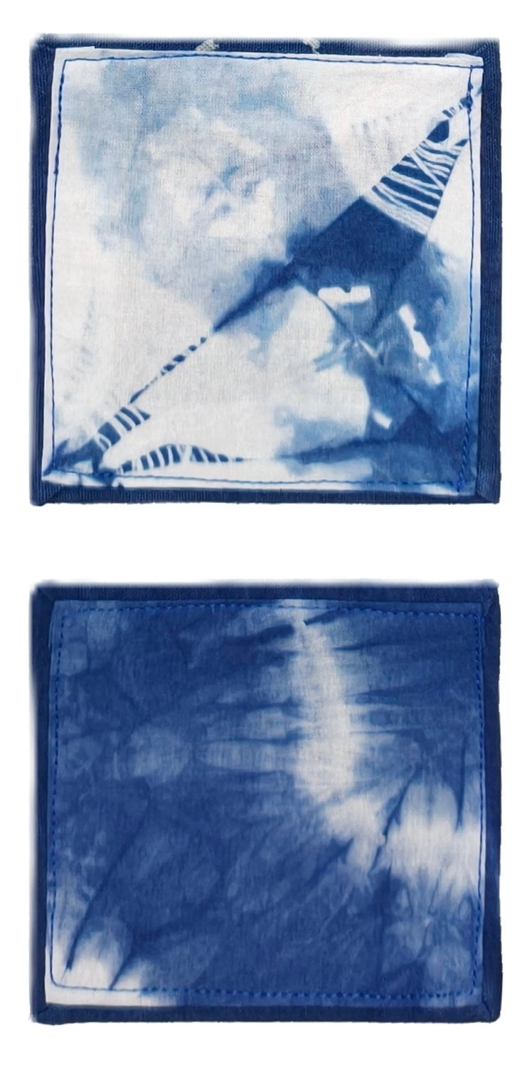 Two blue tie-dye wallets with a star and leaf design.