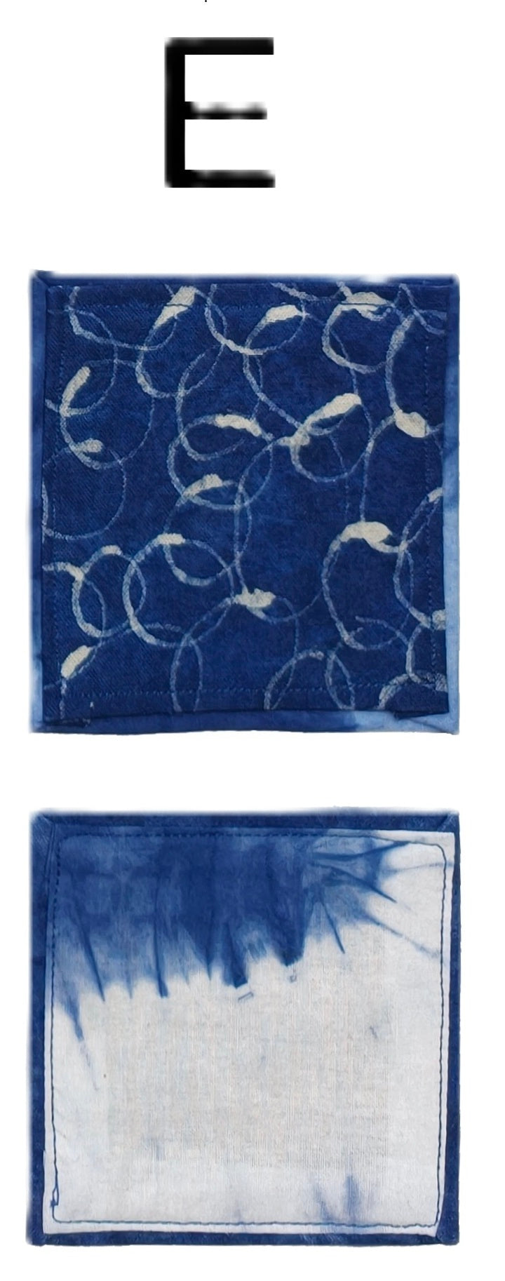 Two blue patterned napkins with a letter 'E' above them.